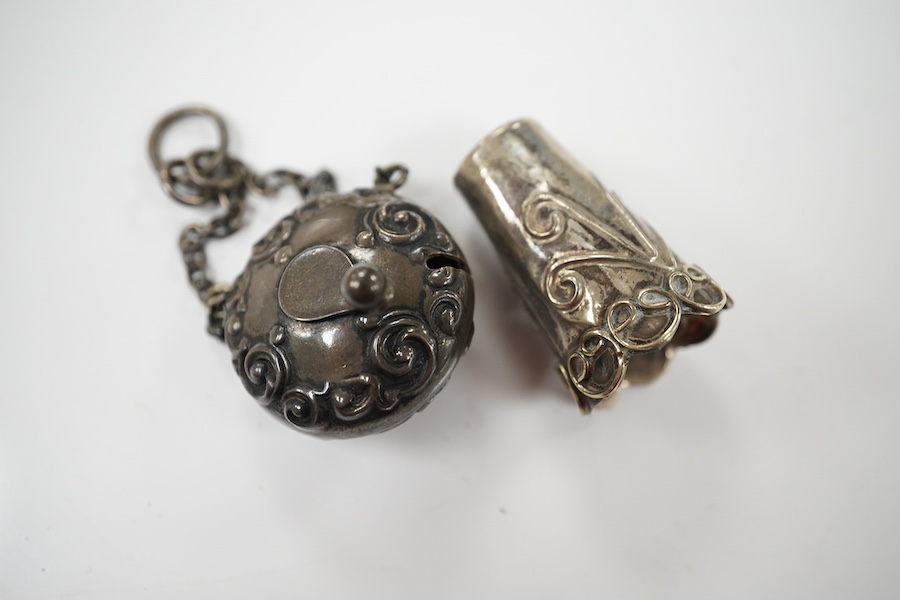 A late Victorian silver tape measure case, Birmingham, 1898, 25mm, with suspension chain and a white metal thimble. Condition - poor to fair